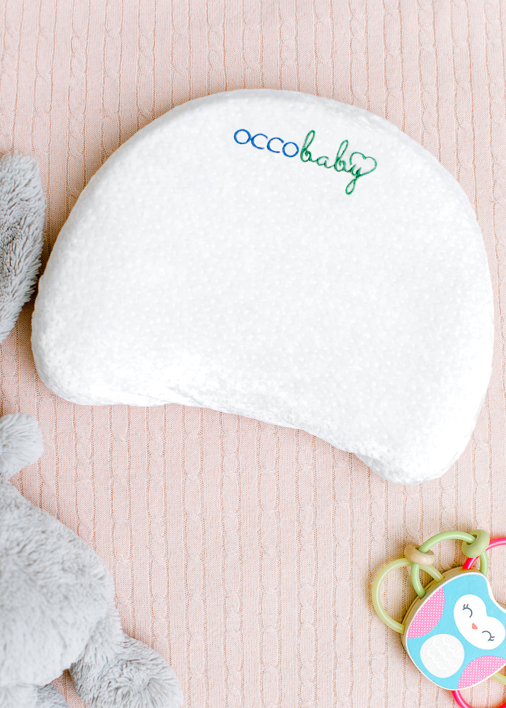 https://www.occobaby.com/cdn/shop/products/pillow-with-teether.jpg?v=1631648577